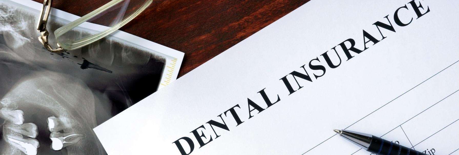 Close-up of a dental insurance document with visible text