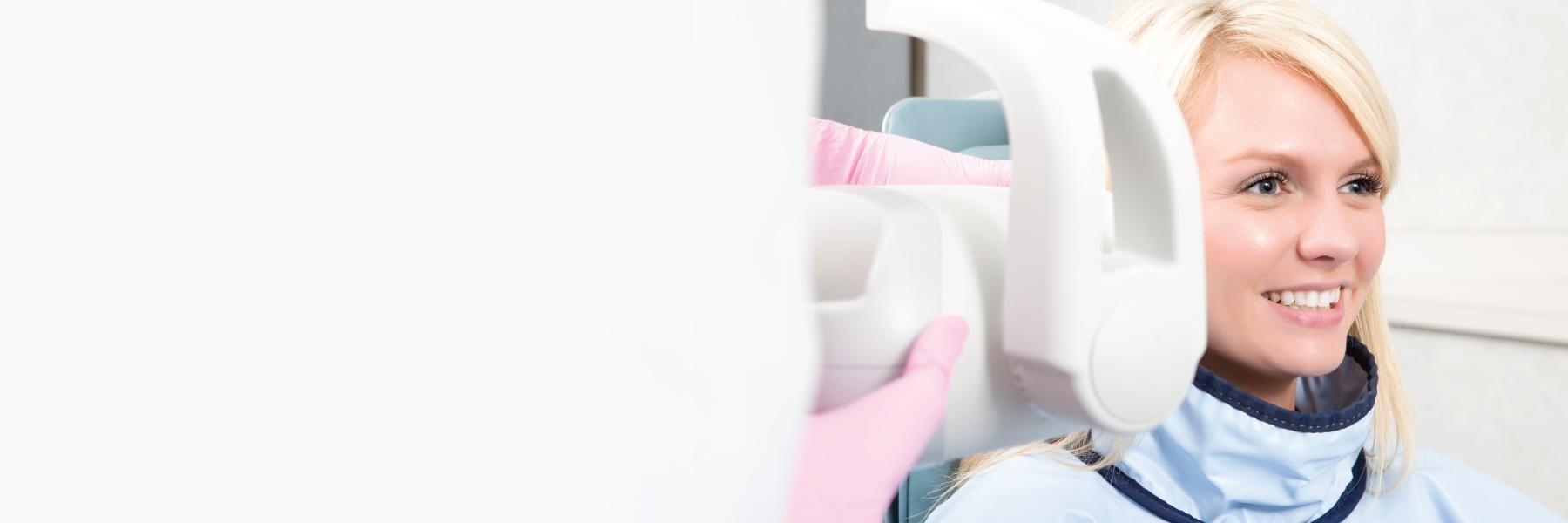 Woman receiving digital x-ray l dentist garland tx