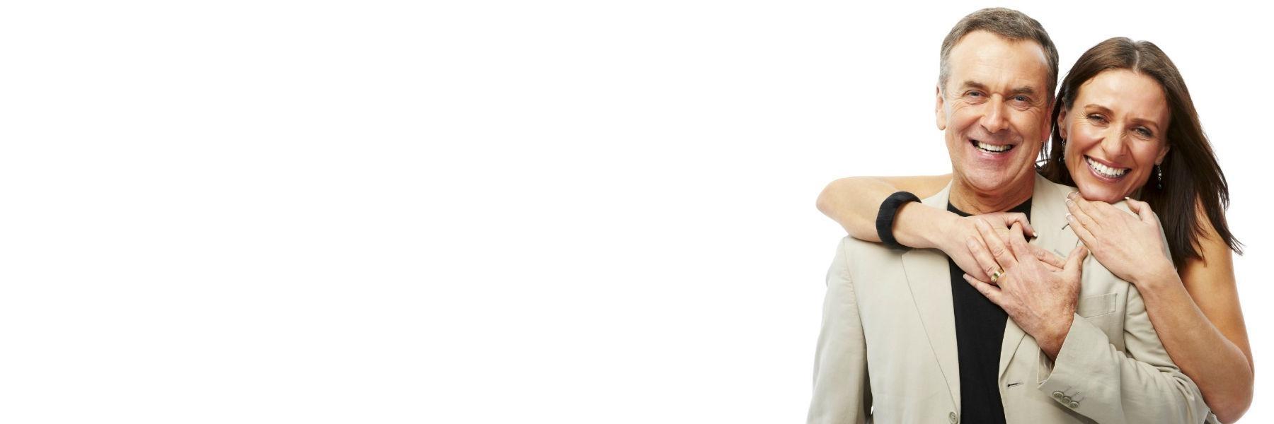 Older couple hugging & smiling l root canals garland tx